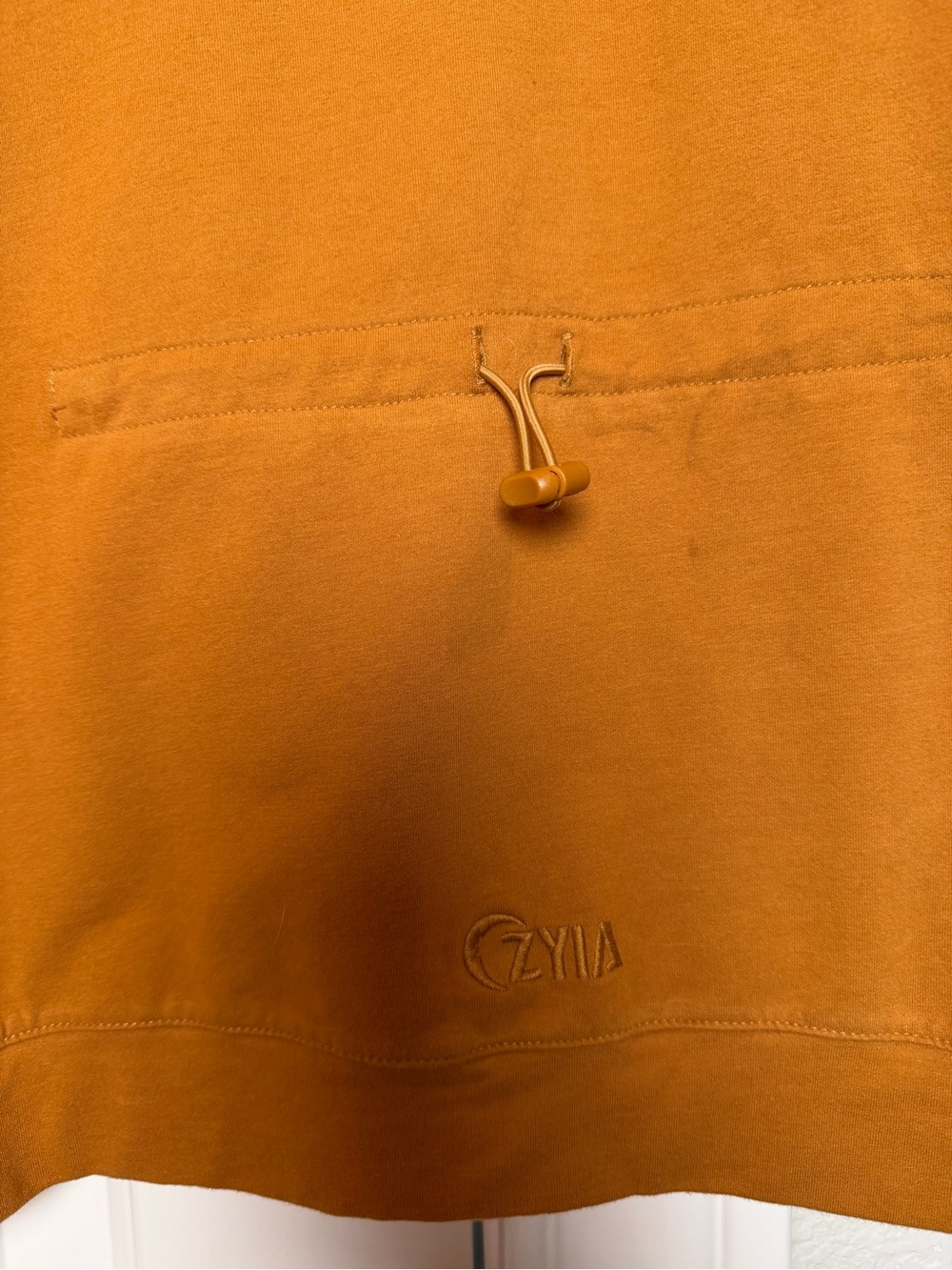 ZYIA Short Sleeve Hooded Pullover in Rust Orange with White Drawstrings - Picture 4 of 4